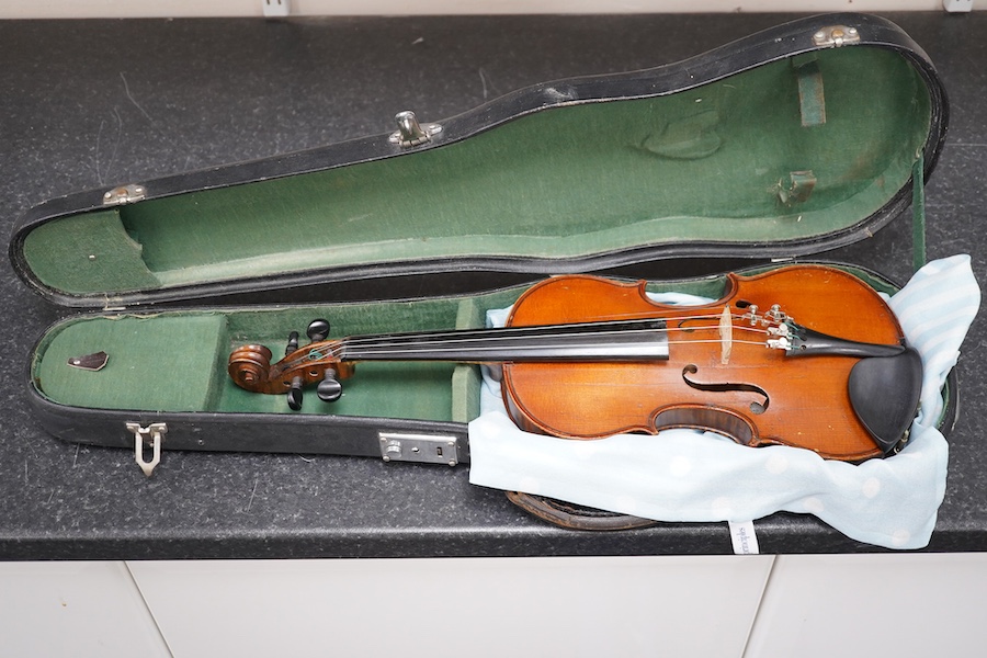 Three violins; a 3/4 Czech, a 1/2 size German and a 1/4 size Czech, all cased. Condition - fair to good